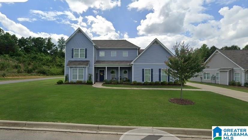 1590 Baxter Ave, Springville, AL 35146 - view of front facade featuring a front lawn