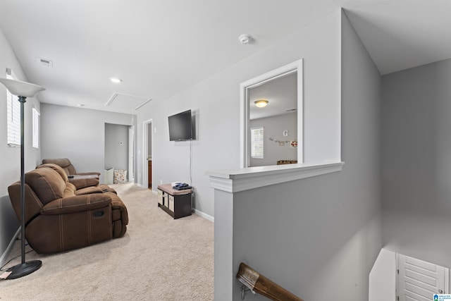 carpeted living room featuring a wealth of natural light