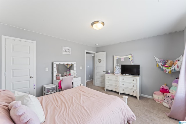 bedroom featuring light colored carpet