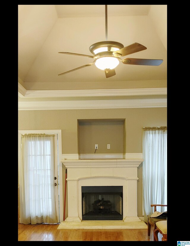 interior space with wood-type flooring and ceiling fan