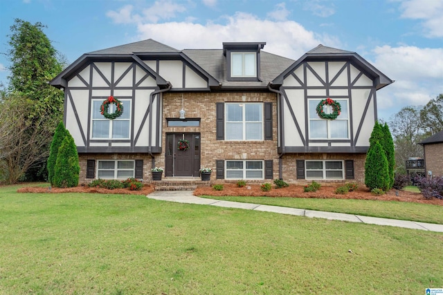 tudor home with a front lawn