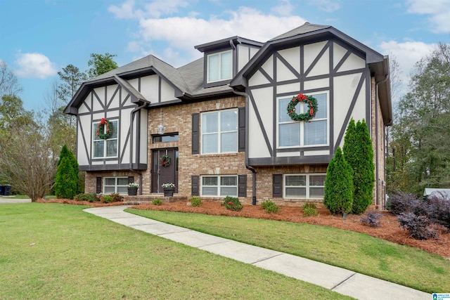 tudor home with a front yard