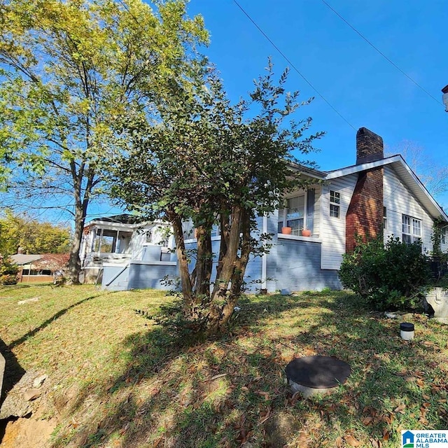 view of home's exterior featuring a lawn