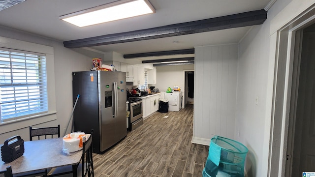 kitchen featuring white cabinets, stainless steel appliances, beamed ceiling, and hardwood / wood-style flooring