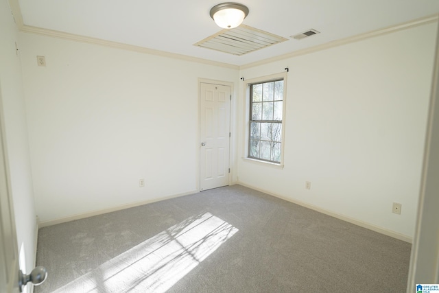 empty room with light colored carpet and crown molding