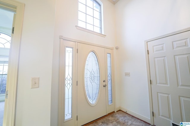 entryway featuring a high ceiling