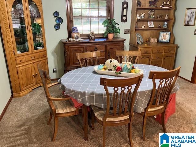 view of carpeted dining space