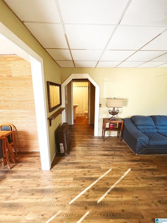 interior space with wood-type flooring and heating unit