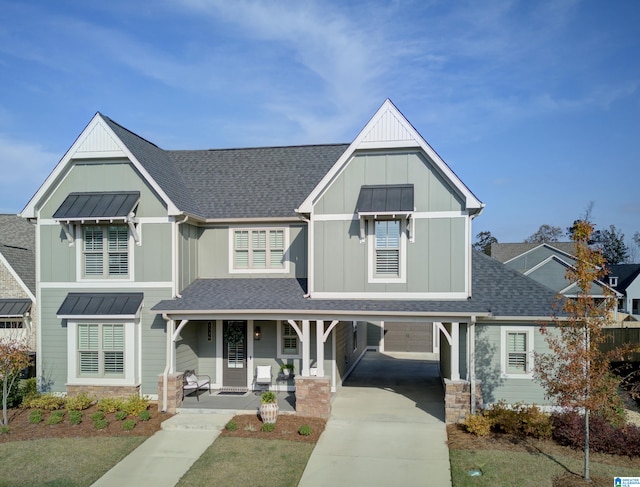 view of front of home featuring a porch and a garage