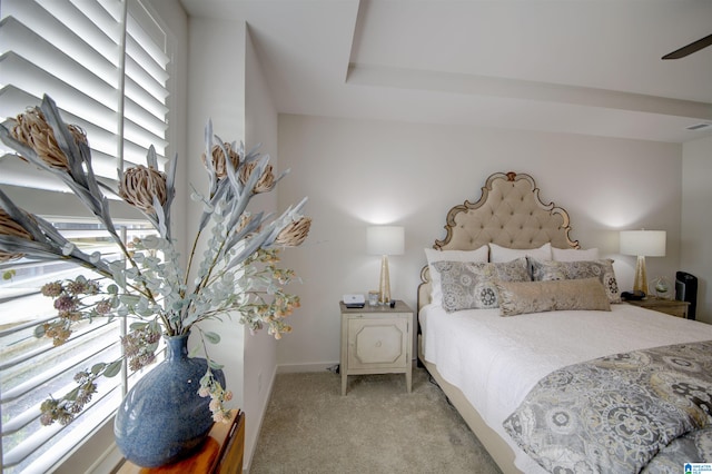 bedroom featuring light colored carpet