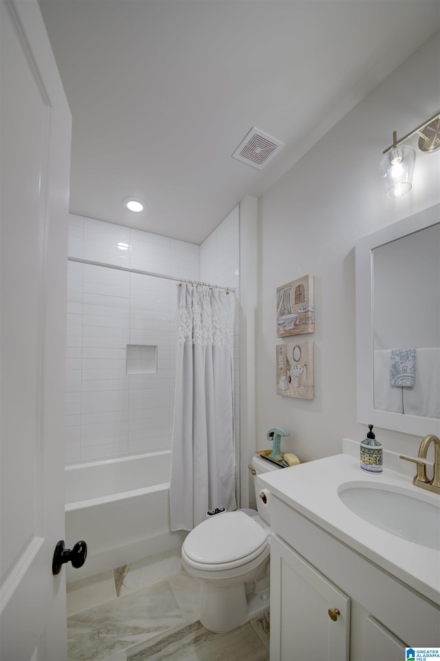 full bathroom with vanity, shower / bath combo, and toilet