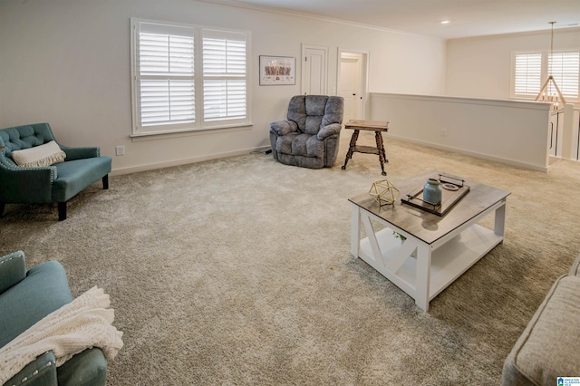 living room featuring light carpet and ornamental molding