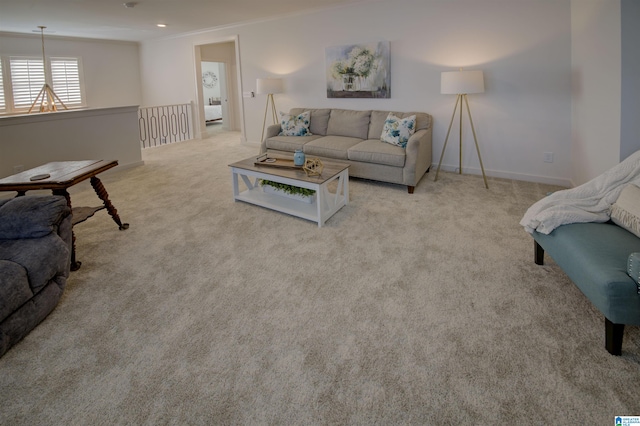 living room with light carpet and crown molding