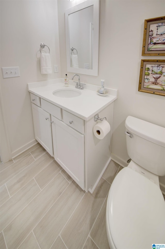 bathroom with vanity and toilet