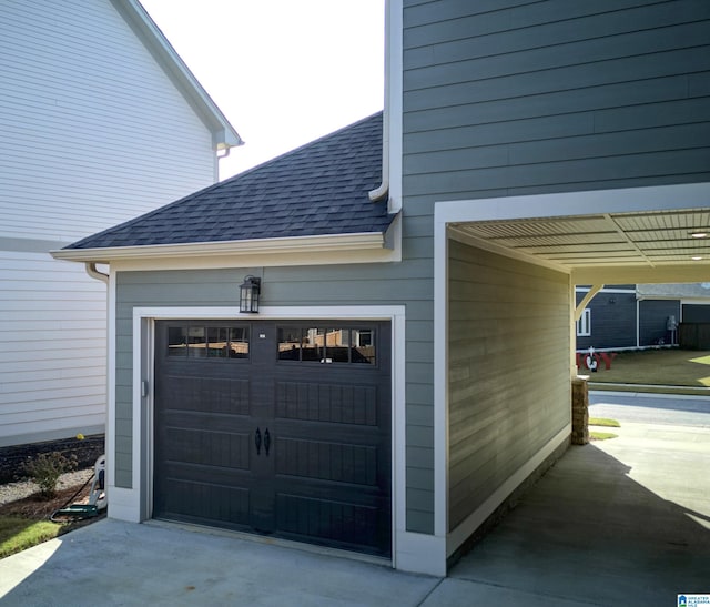 garage featuring a carport