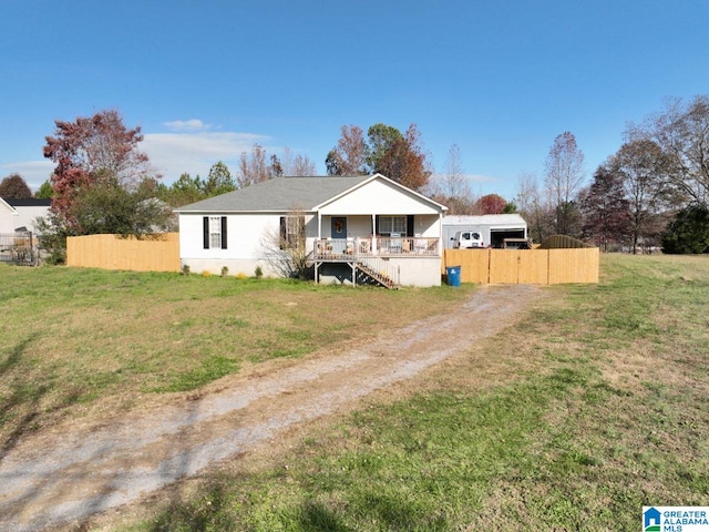 view of front of home with covered porch and a front yard