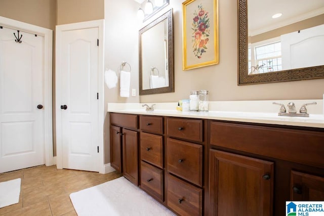 bathroom with tile patterned flooring, vanity, and ornamental molding