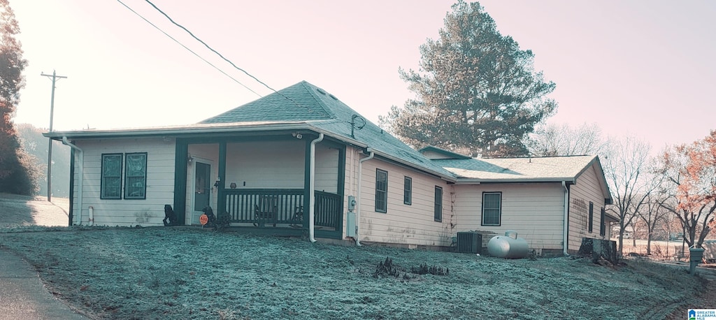 exterior space featuring cooling unit and covered porch