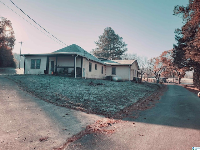 view of front of house with central AC unit and a porch