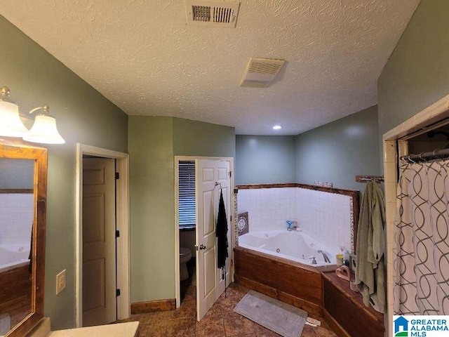 bathroom with tile patterned flooring, a textured ceiling, toilet, and plus walk in shower