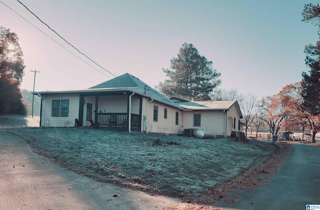 view of front of home featuring covered porch and central AC