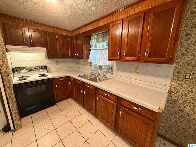 kitchen featuring backsplash, a textured ceiling, sink, light tile patterned floors, and electric range