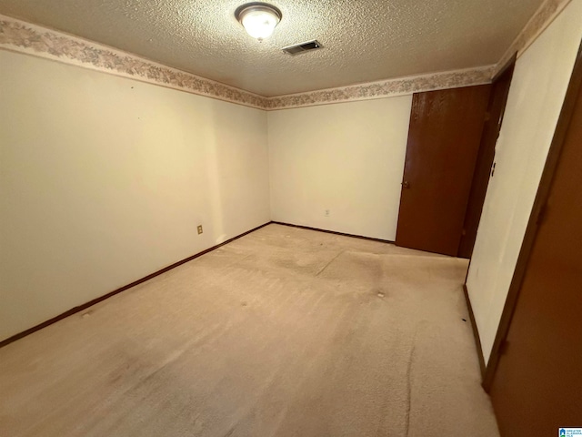 empty room featuring a textured ceiling