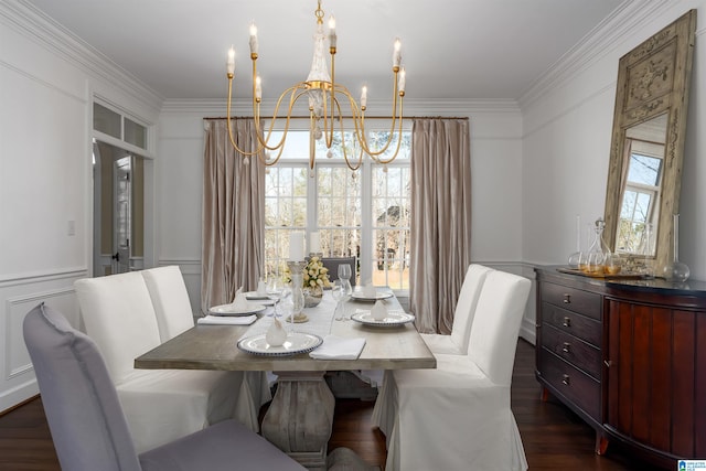 dining space with ornamental molding, dark wood-type flooring, and a notable chandelier