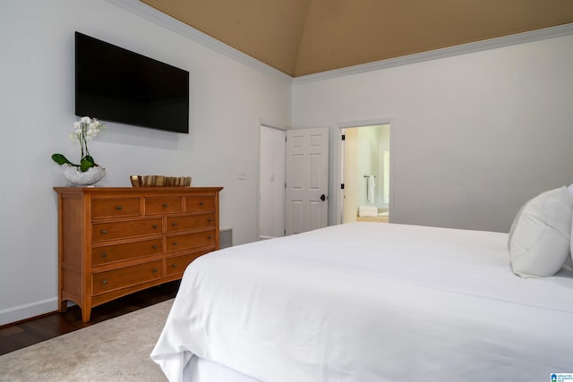 bedroom featuring dark hardwood / wood-style flooring, high vaulted ceiling, and ensuite bath