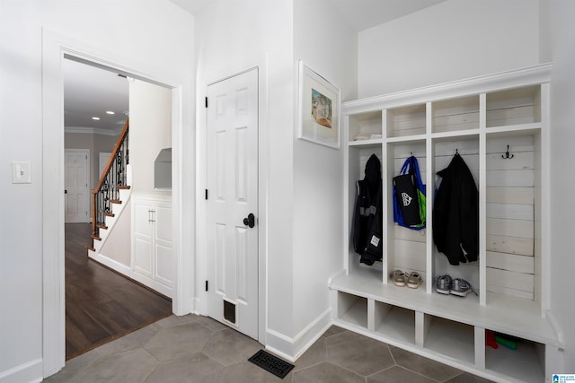 mudroom featuring hardwood / wood-style floors and crown molding