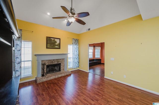 unfurnished living room with a fireplace, ceiling fan, hardwood / wood-style floors, and lofted ceiling