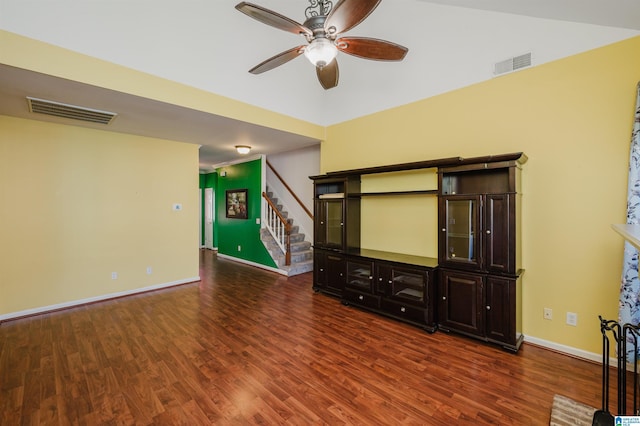 unfurnished living room featuring dark hardwood / wood-style flooring and ceiling fan