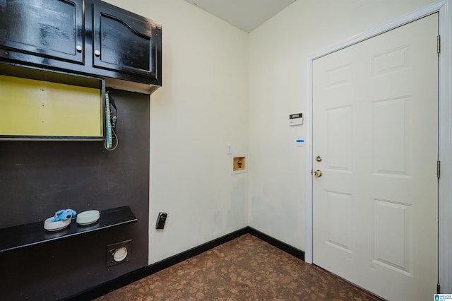 clothes washing area with cabinets and washer hookup