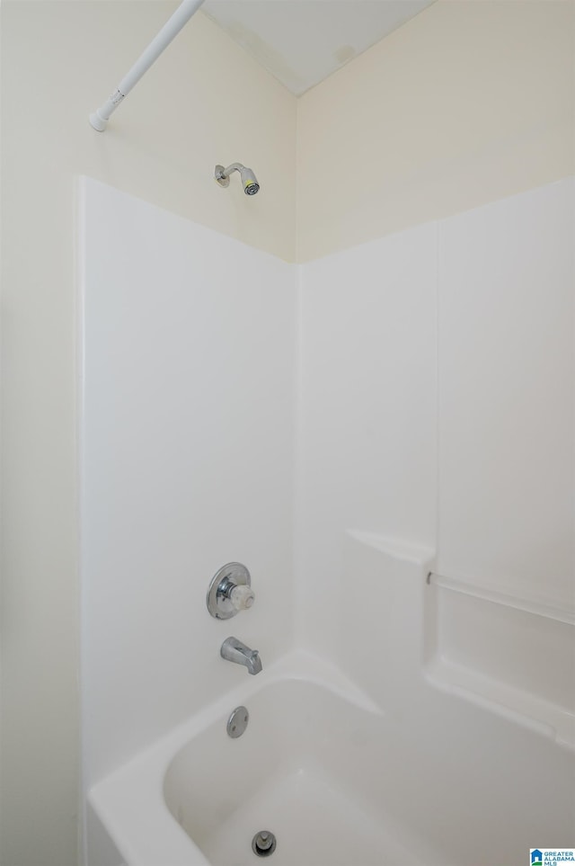 bathroom featuring  shower combination