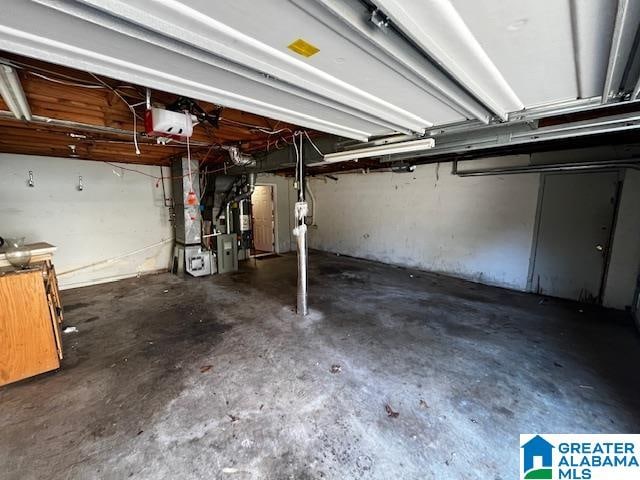 garage with a garage door opener and heating unit