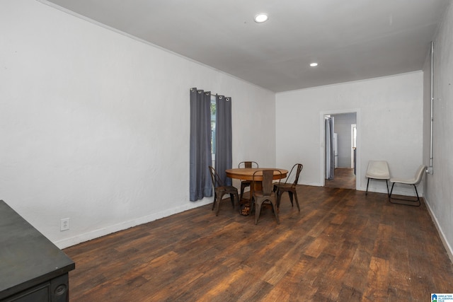 dining area with dark hardwood / wood-style flooring