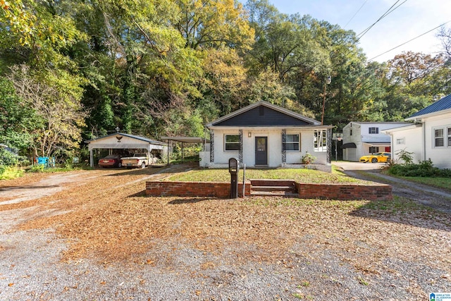 view of front of home featuring a porch and a carport