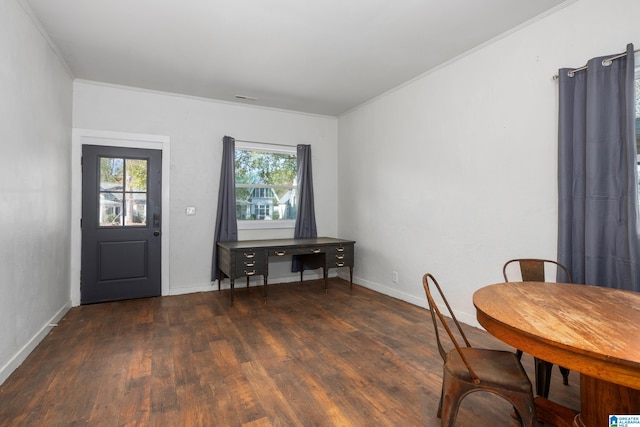 dining area with dark hardwood / wood-style flooring and ornamental molding