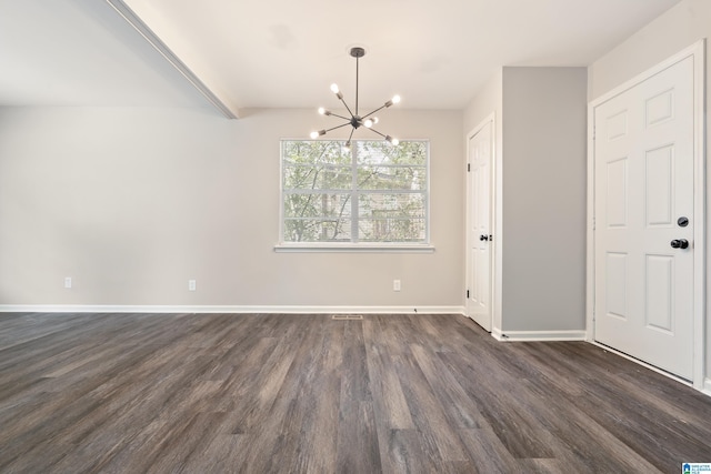 unfurnished dining area featuring dark hardwood / wood-style floors and an inviting chandelier