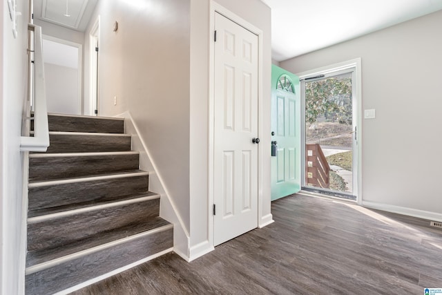 entrance foyer with plenty of natural light and dark wood-type flooring