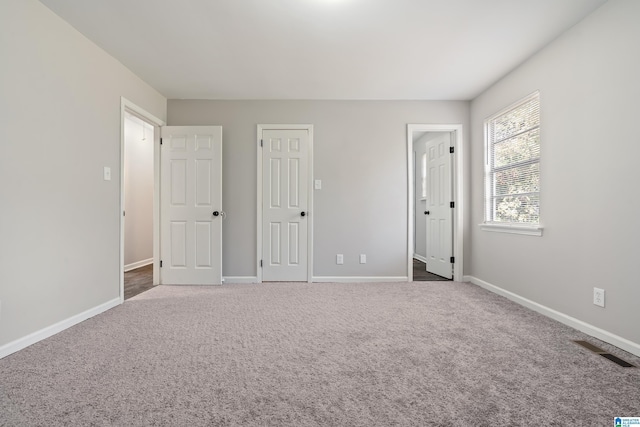 unfurnished bedroom with carpet flooring