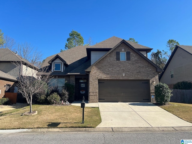 view of front of house with a garage and a front yard