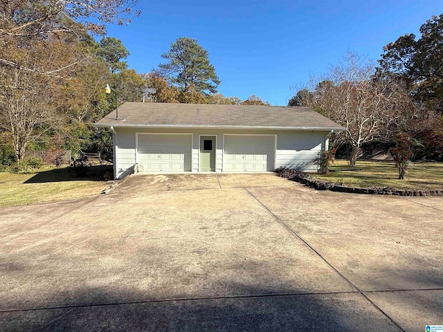 garage featuring a lawn