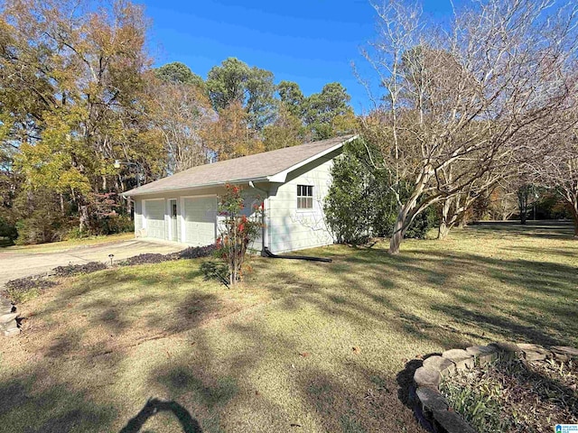 view of front of home with a garage and a front yard