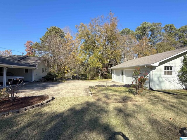 1807 Moncrief Rd, Gardendale, AL 35071 - view of yard featuring a garage and driveway