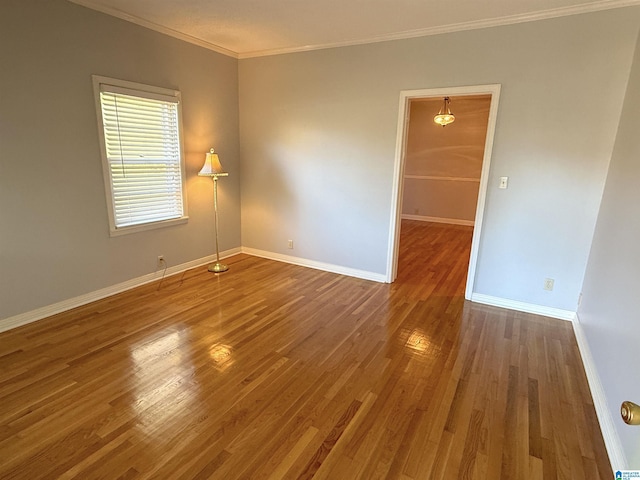 1807 Moncrief Rd, Gardendale, AL 35071 - spare room with ornamental molding, wood finished floors, and baseboards