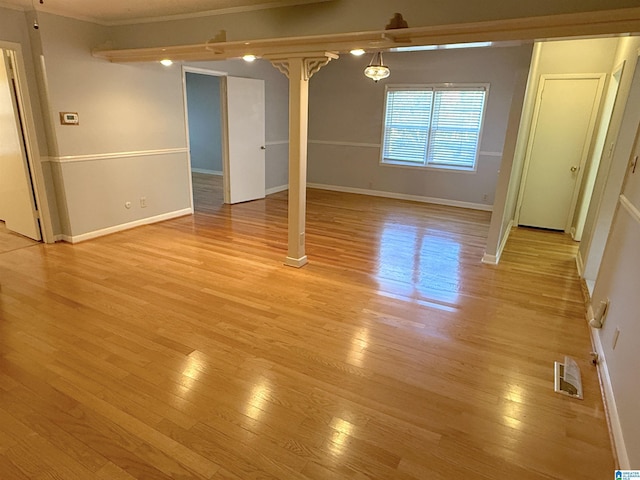 1807 Moncrief Rd, Gardendale, AL 35071 - unfurnished room featuring light wood-style flooring, baseboards, and crown molding