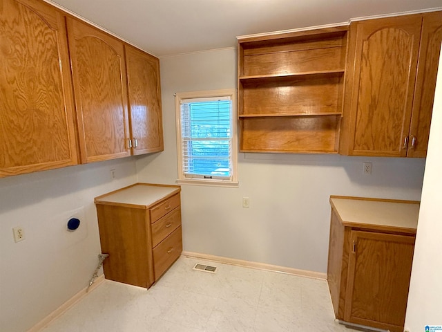 washroom with cabinets and electric dryer hookup