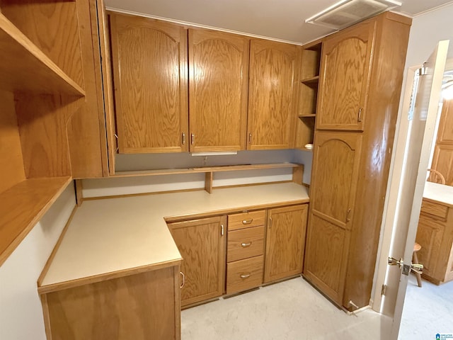 1807 Moncrief Rd, Gardendale, AL 35071 - kitchen with open shelves, brown cabinetry, and light countertops