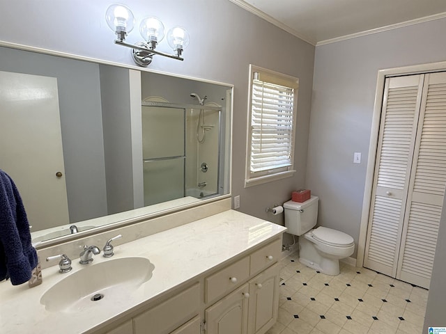 1807 Moncrief Rd, Gardendale, AL 35071 - full bath with a closet, ornamental molding, toilet, vanity, and tile patterned floors